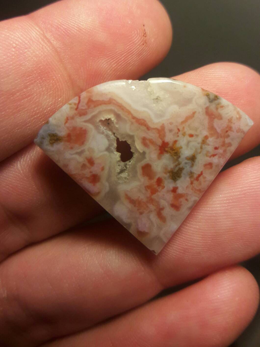 Freeform pink moss agate cabachon.