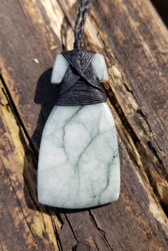Hand carved Guatemala jadeite toki pendant on hand braided adjustable cord