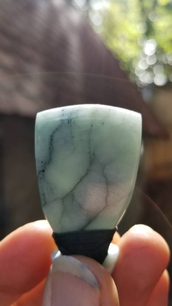 Hand carved Guatemala jadeite toki pendant on hand braided adjustable cord