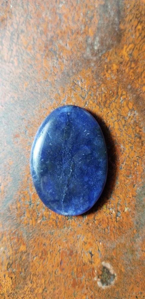 38.8ct chatoyant sodalite oval cabochon